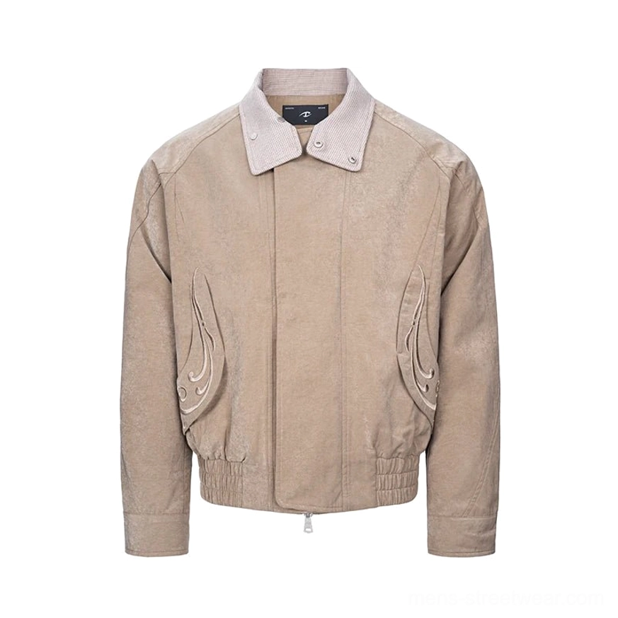 Khaki cropped bomber jacket with layered houndstooth collar, flame embroidery, front zipper, and elasticated hem shown in a studio flat lay