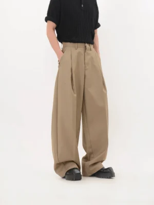 Front view of khaki Korean streetwear wide-leg trousers with double pleats, belt loops, relaxed fit, and stacked full-length hems