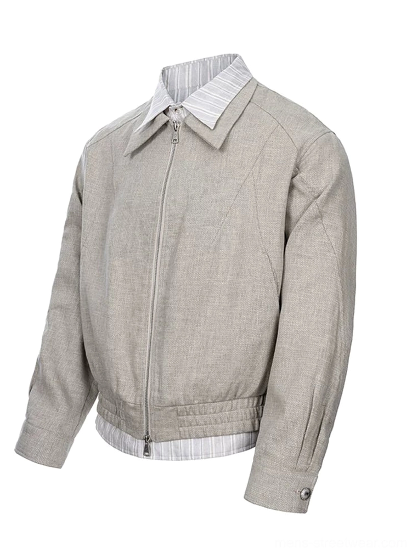 Khaki linen blend layered collar zip jacket side view showing snap cuffs striped shirt hem and relaxed silhouette
