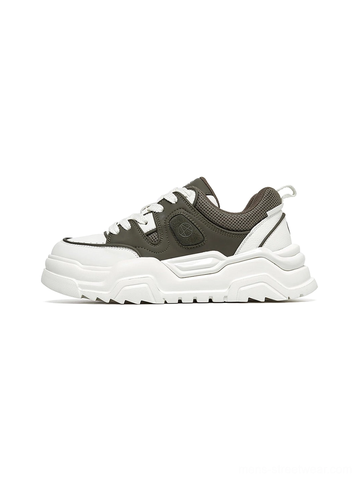 Khaki monochromatic chunky platform sneaker studio display showcasing complete silhouette neutral aesthetic versatility for streetwear styling
