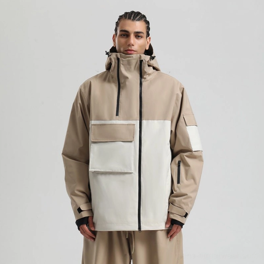 Khaki shoulder and off white front colorblock snowboard jacket with hood, dual flap pockets, central zipper, and thumbhole cuffs