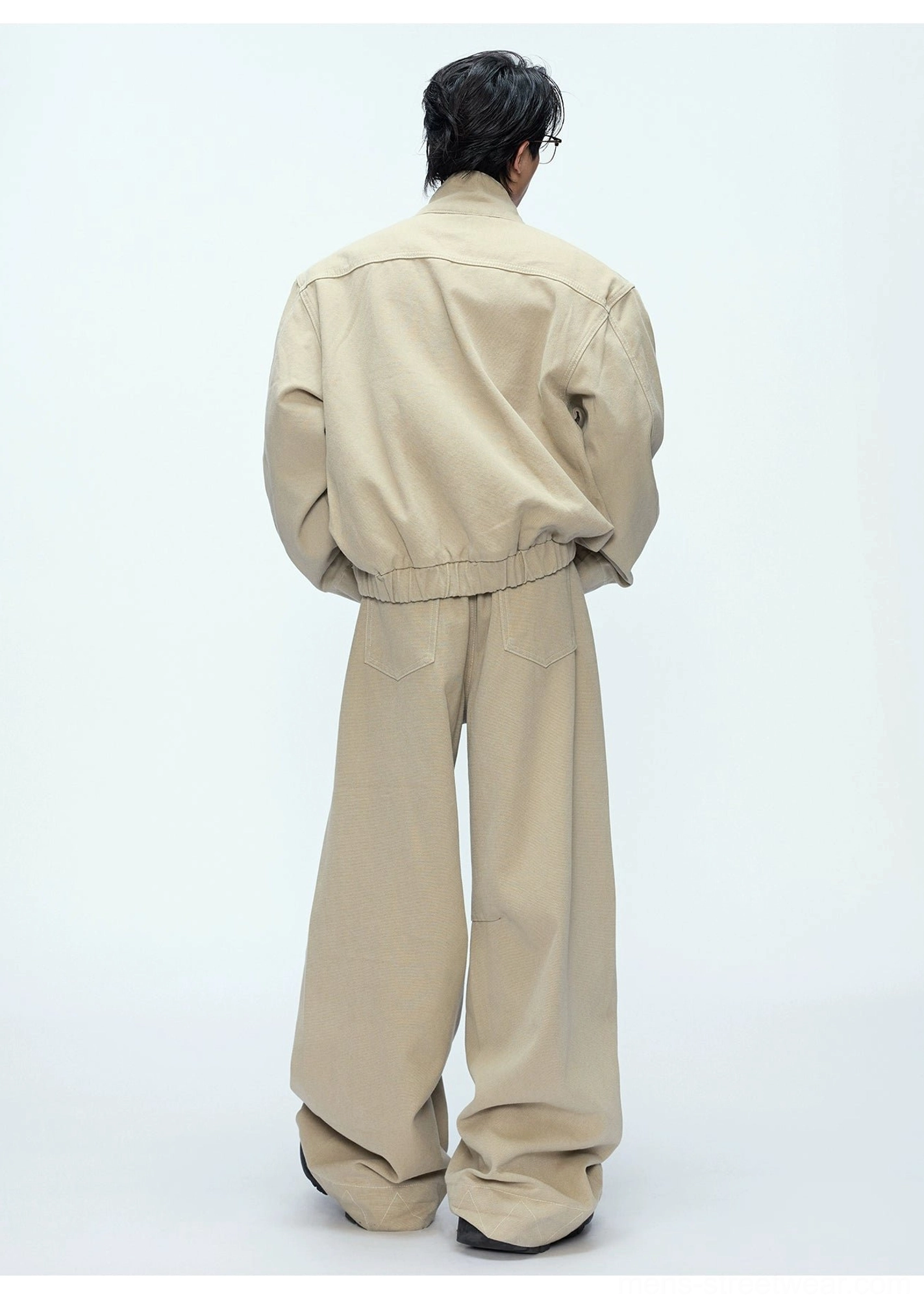 Khaki oversized bomber jacket and wide-leg trousers back view showing elasticated hem back yoke seam and rear trouser pockets