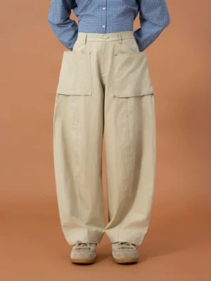 Khaki oversized utility cargo pod pants shown from the front with large flap pockets, belt loops, and relaxed wide-leg workwear styling