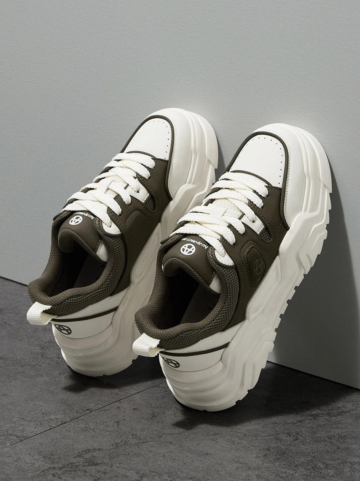 Khaki platform sneaker lifestyle styled on-foot angle showing casual streetwear integration comfortable silhouette and contemporary aesthetic