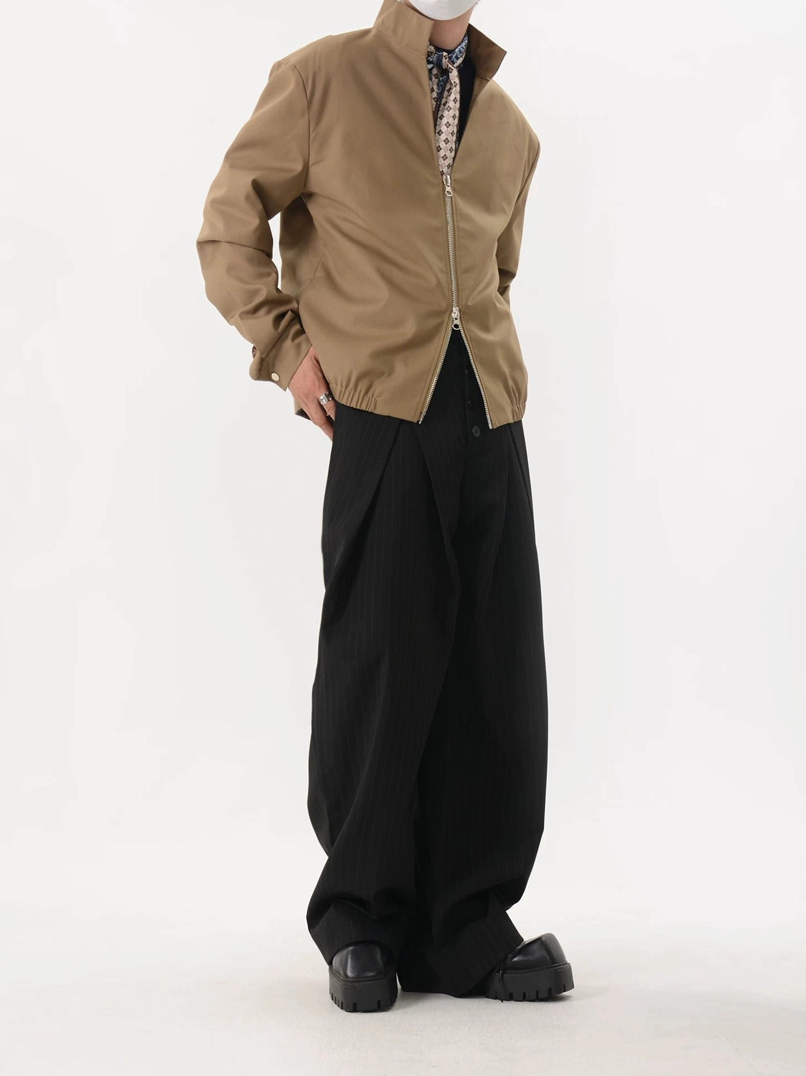 Khaki relaxed blouson jacket side back view showing loose fit and elasticated gathered waist hem