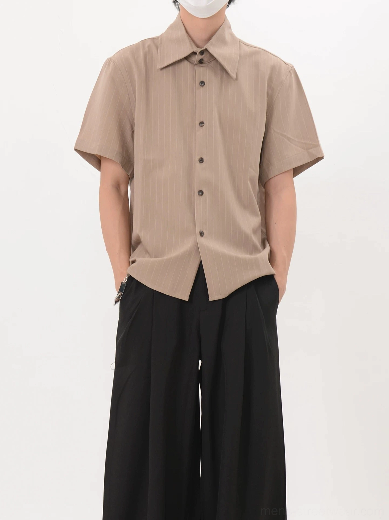Khaki vertical stripe short sleeve button up shirt shown from the front with relaxed Seoul streetwear fit and curved hem
