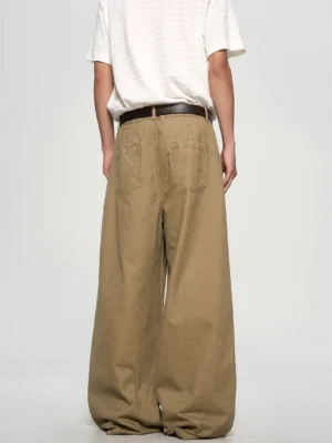 Back view of khaki wide-leg cotton twill chino pants showing rear patch pockets and relaxed oversized streetwear fit