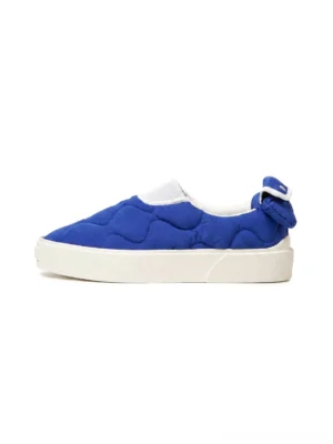 Klein Blue quilted heart slip-on skate shoes with rear bow detail and thick off-white platform sole shown from a side view