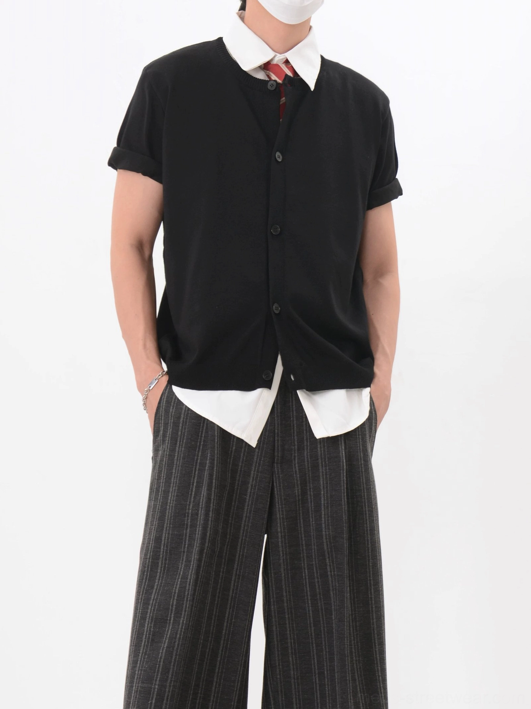 Black button-front short sleeve knit cardigan with V-neck and red tie in Korean-inspired wide-leg trouser styling
