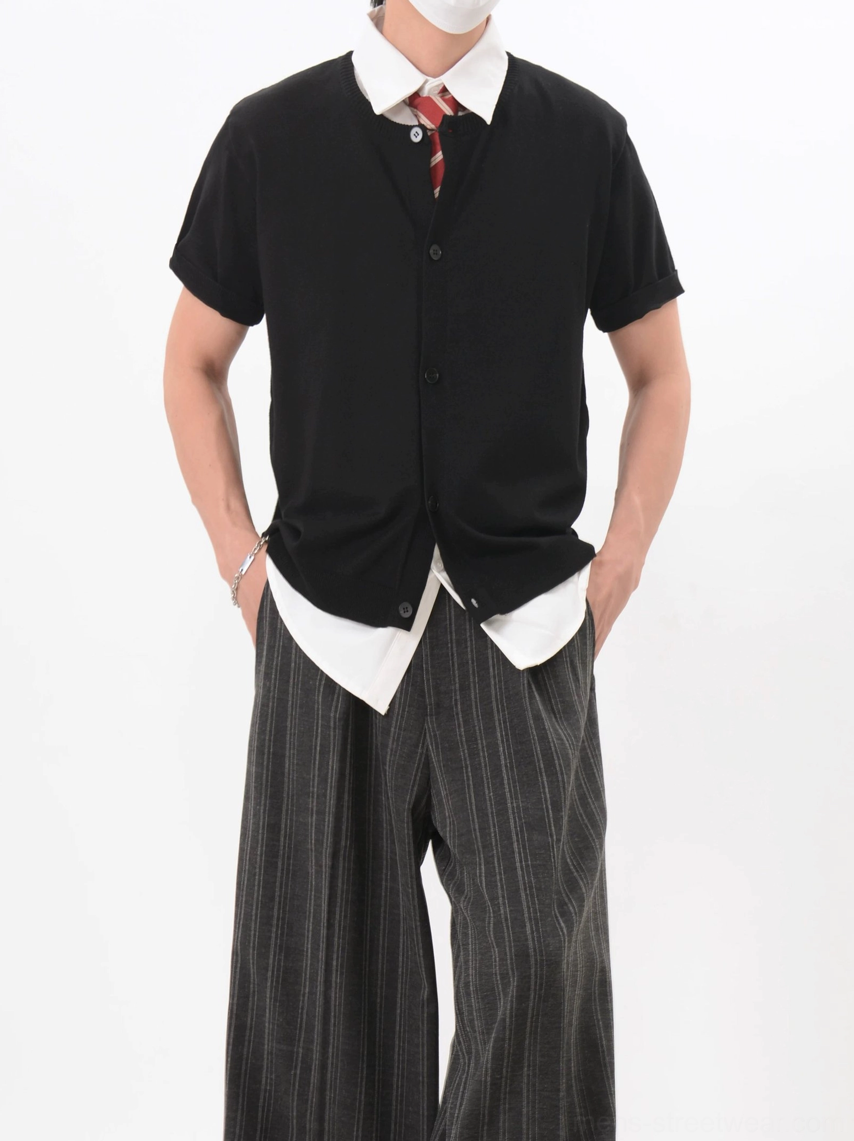 Black Korean style short sleeve button knit cardigan with red tie and relaxed wide-leg black trousers front view