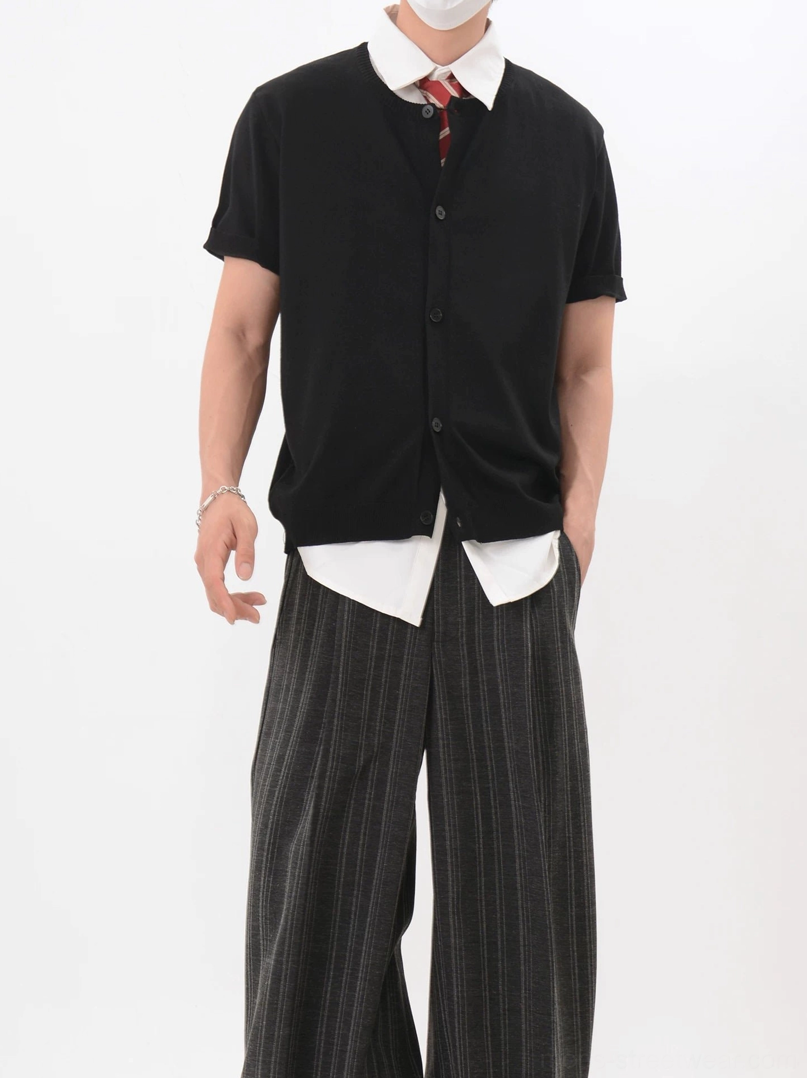Black short sleeve V-neck button knit cardigan styled over a white collared shirt with red tie Korean fashion outfit