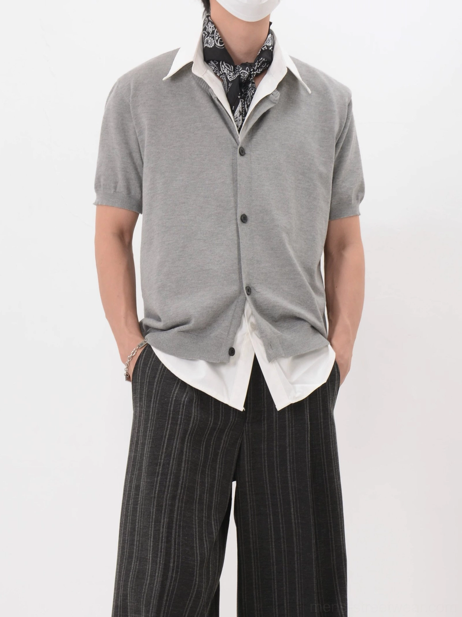 Heather gray fine-gauge short sleeve knit cardigan styled with patterned scarf and striped wide-leg pants