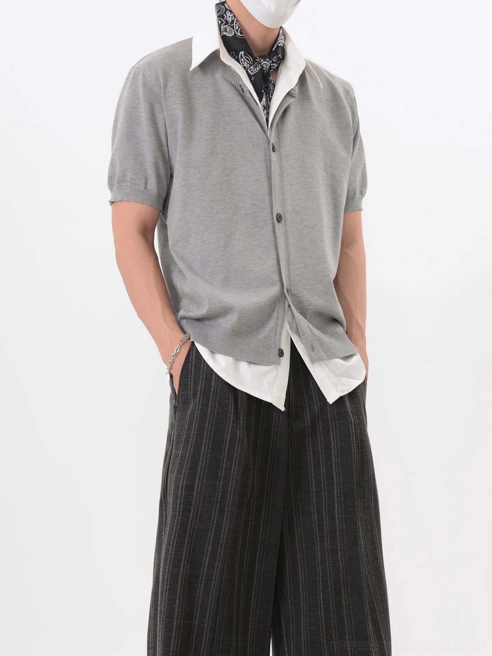 Heather gray Korean layered look short sleeve V-neck knit cardigan styled with white shirt hem and paisley neck scarf front view