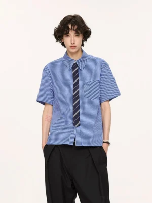 Blue gingham Korean preppy short sleeve button up shirt with navy striped tie styled with loose black trousers