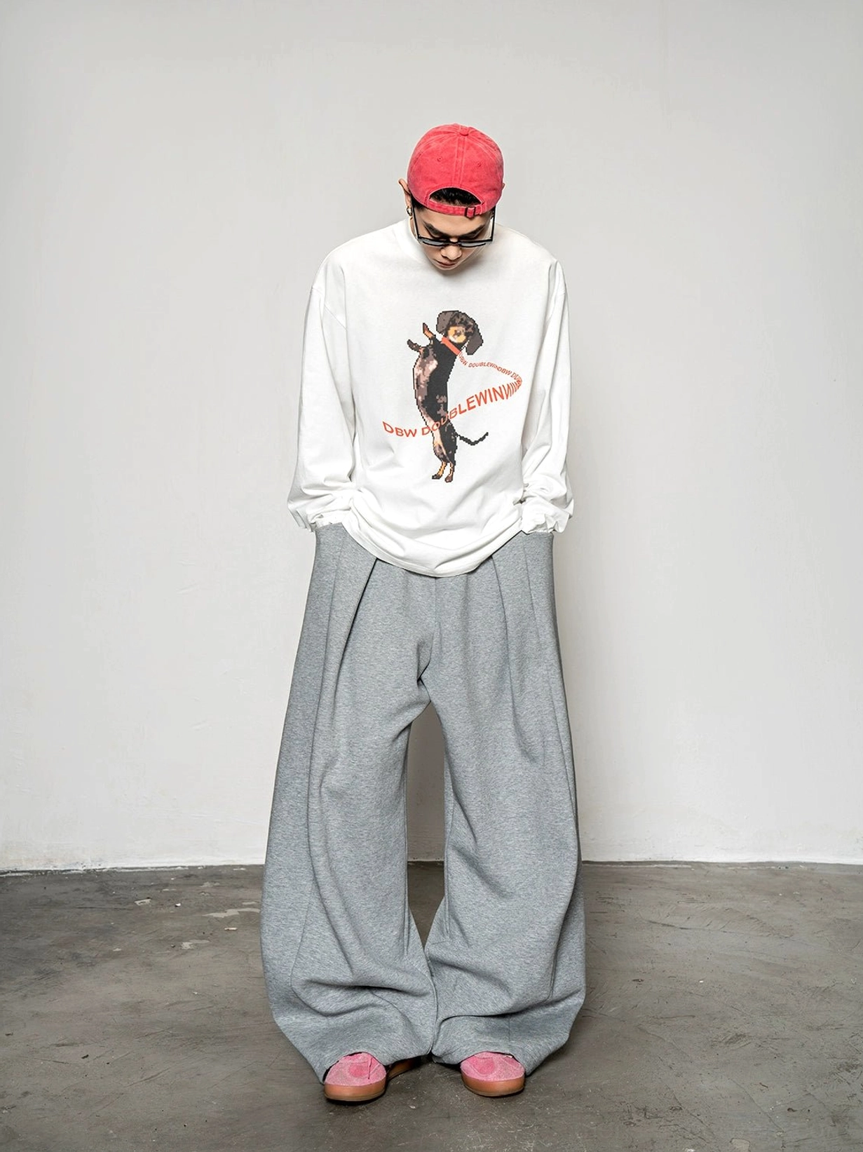 Full body Korean streetwear outfit with white dachshund print long sleeve T-shirt and relaxed grey wide leg trousers