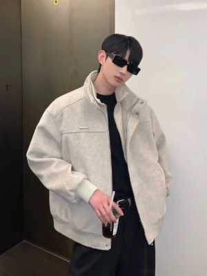 Male model wearing a heather grey Korean streetwear stand collar wool-blend bomber jacket in a relaxed boxy fit