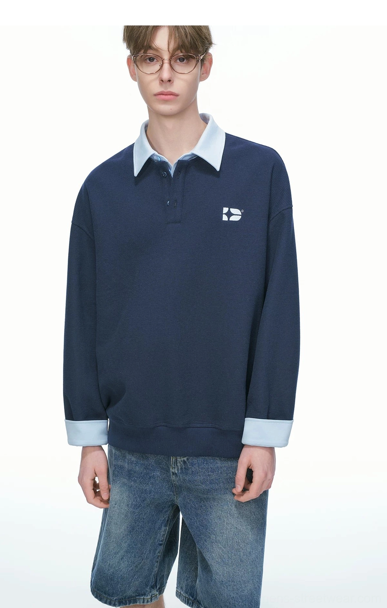 Korean streetwear rugby sweatshirt design featuring a loose silhouette varsity collar textured knit and quarter-button front