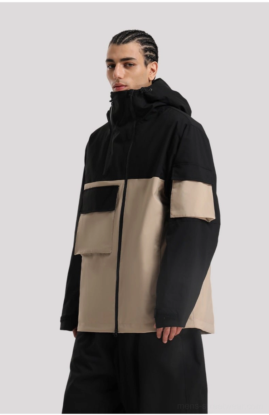 Korean streetwear inspired ski jacket with bold panel design, high collar, attached hood, wind protection, and utility pockets