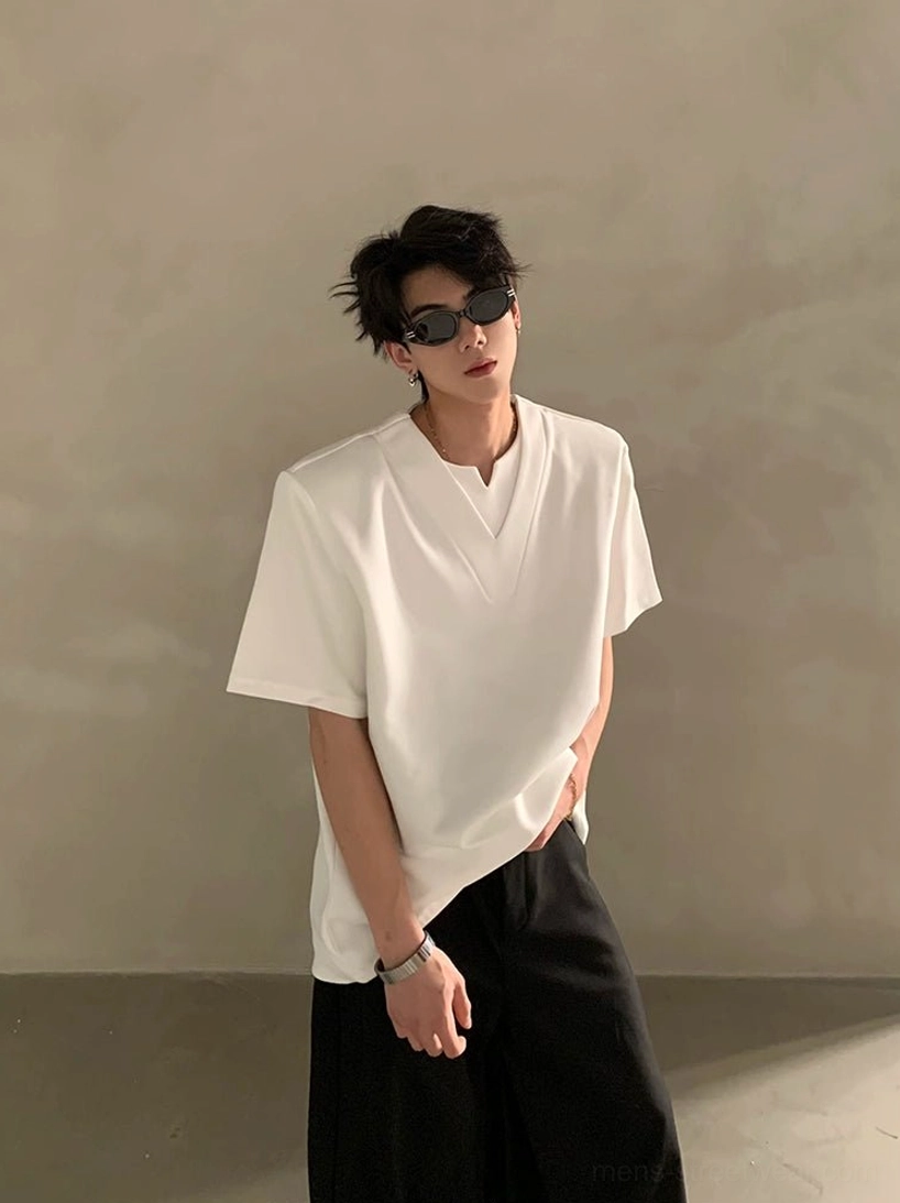 White Korean streetwear deep V notched neck short sleeve shirt shown in a relaxed three quarter front view with minimalist styling