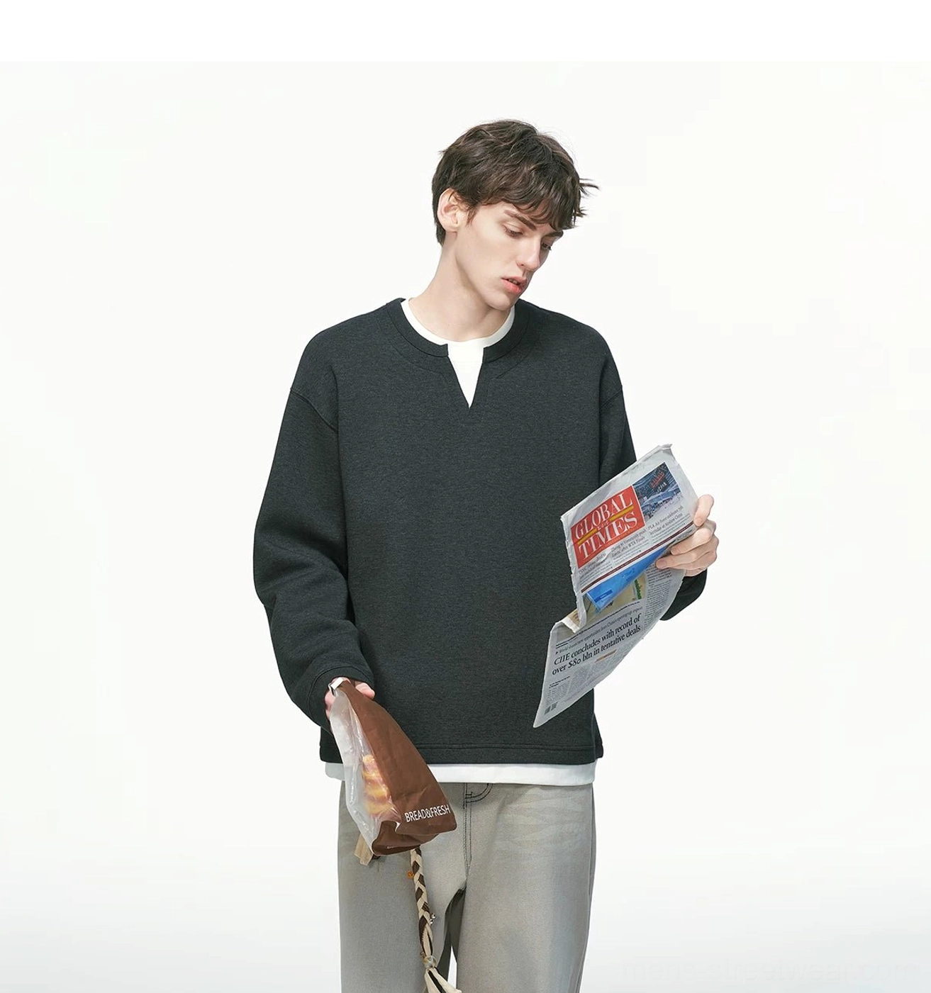 Korean style men's oversized sweatshirt with clean solid color construction, layered neckline, and relaxed urban fashion silhouette