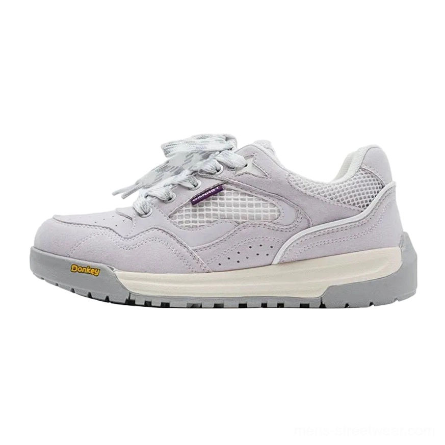 Lavender purple retro runner sneakers with suede mesh upper purple tongue and contrasting yellow outsole detail