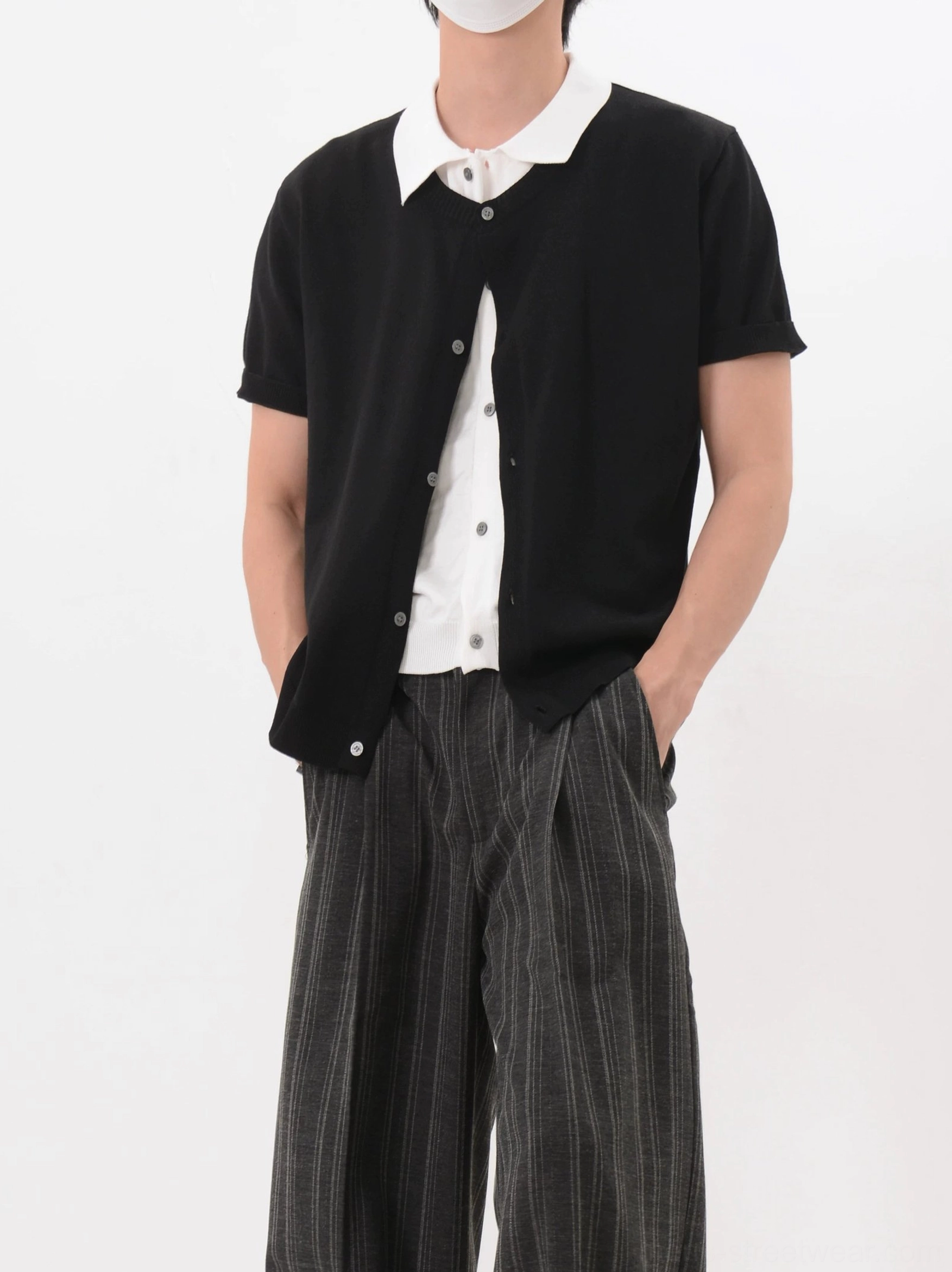 Black short sleeve knit cardigan shirt with integrated white collar panel and naturally draped fine-gauge texture