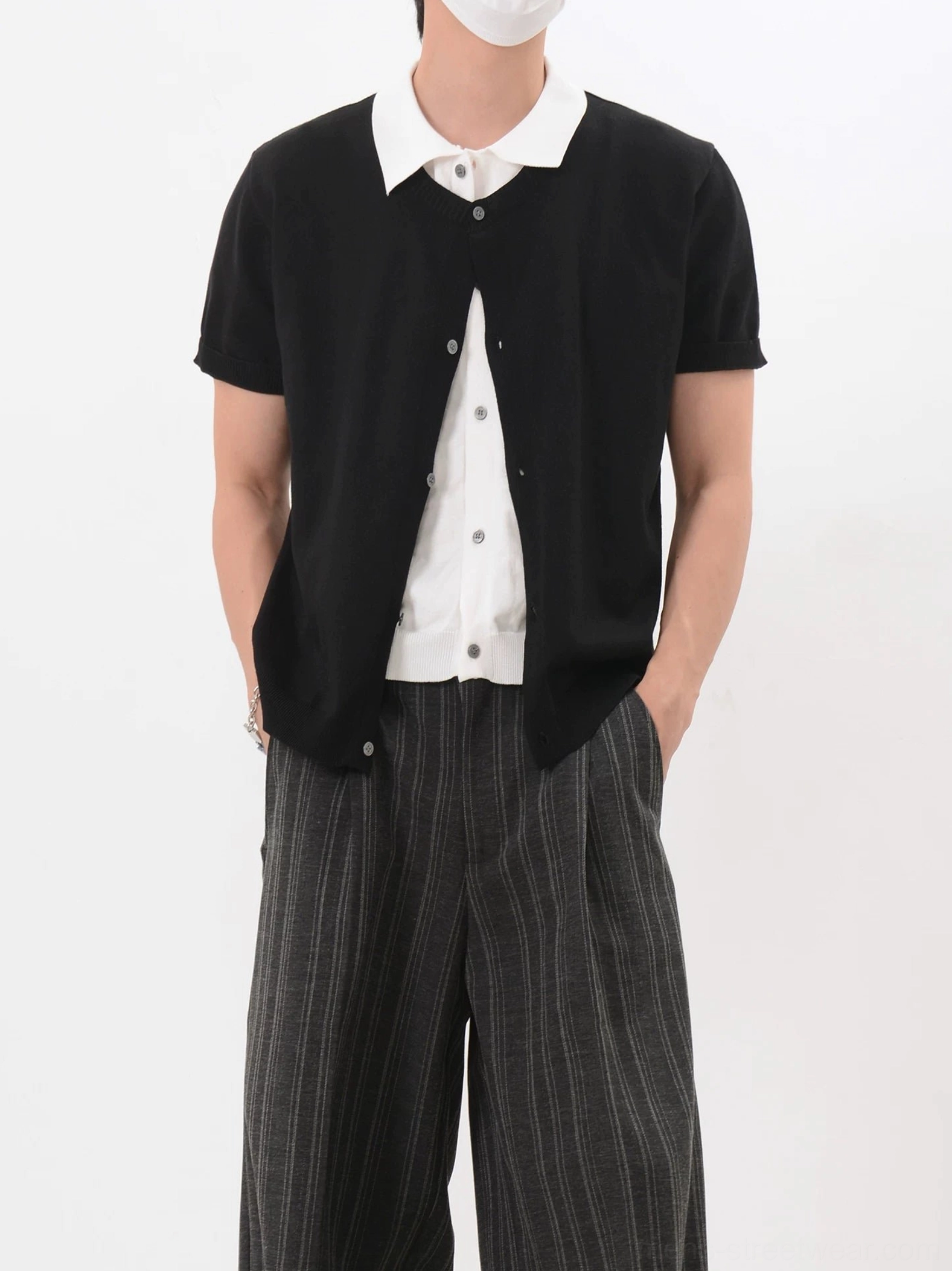 Black layered collar knit cardigan shirt with white button-up insert shown from the front in Korean preppy streetwear styling