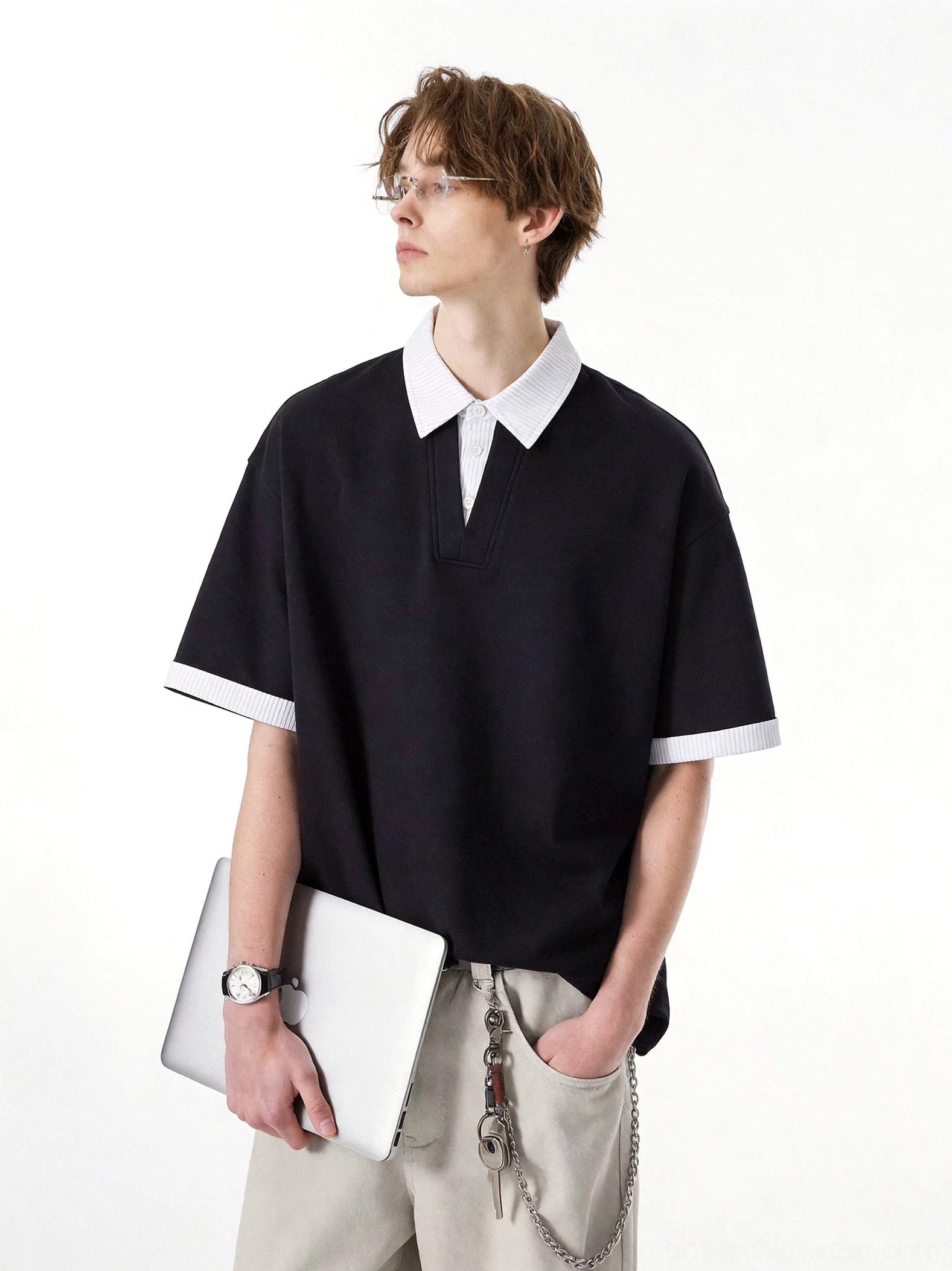 Black layered collar oversized knit polo tee in Korean streetwear style shown in left profile on male model