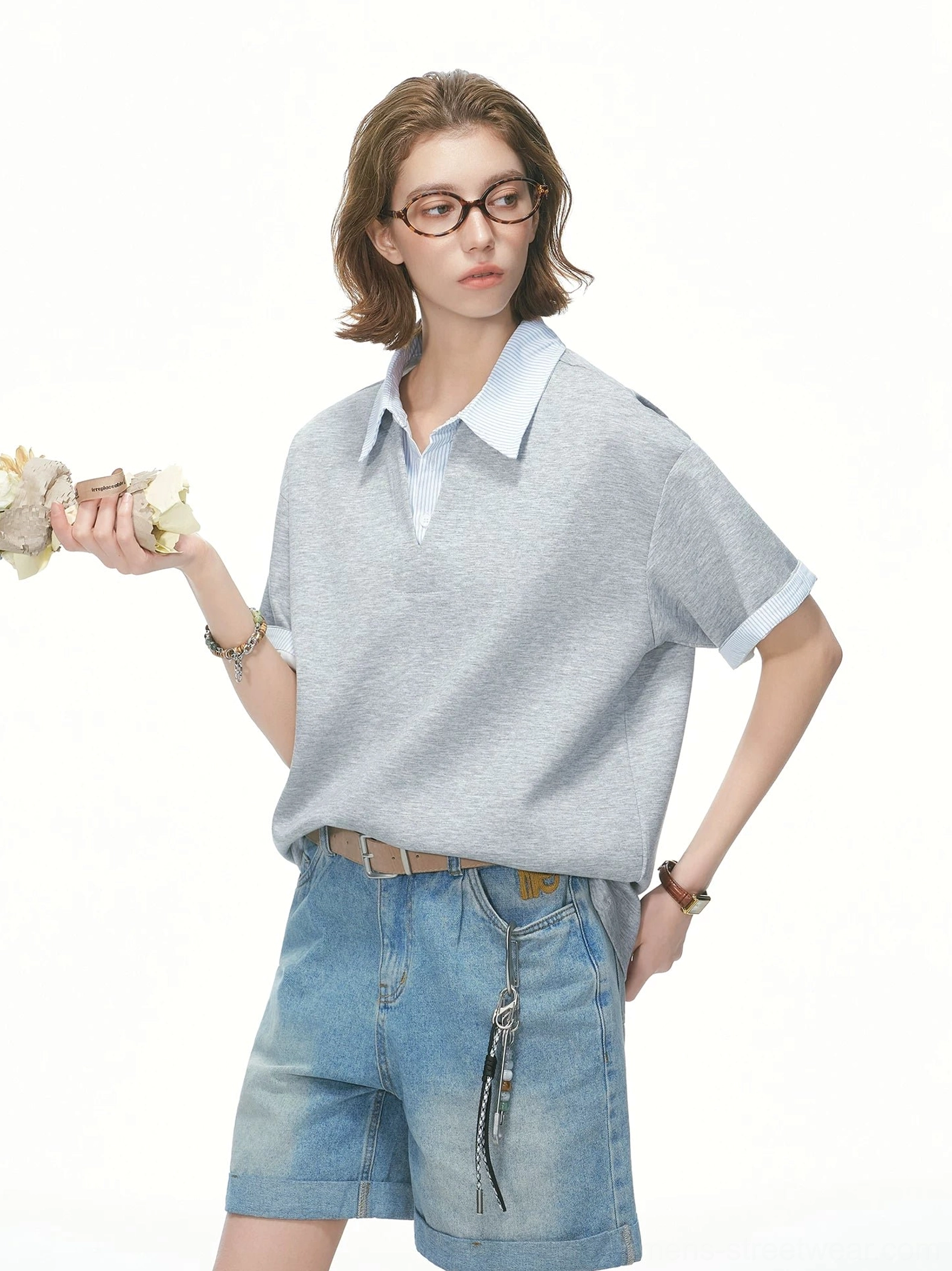 Heather grey layered collar oversized knit polo tee with light blue striped collar styled with denim shorts