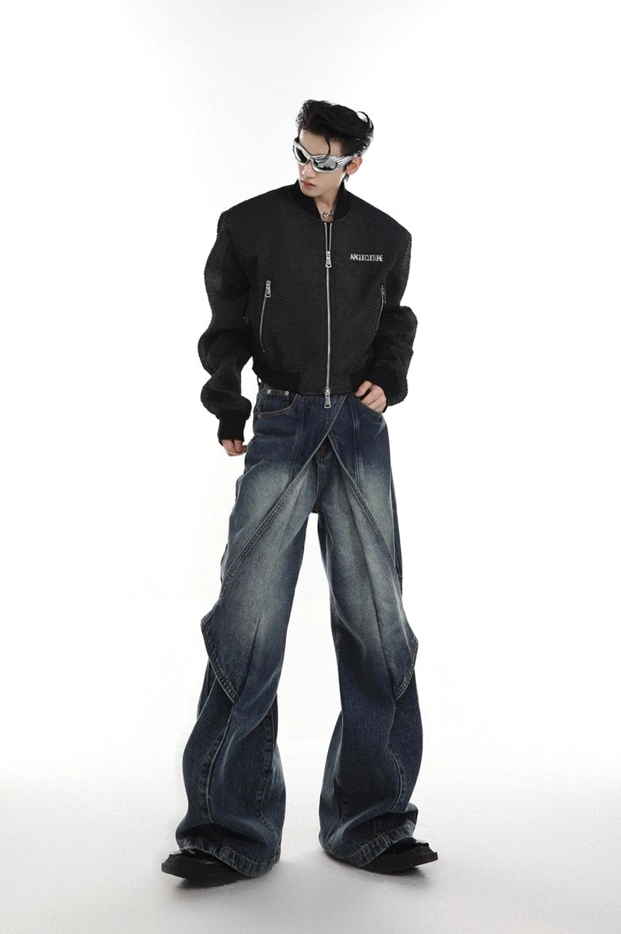 Blue layered flared denim jeans styled with black bomber jacket and racing glasses for Seoul streetwear look