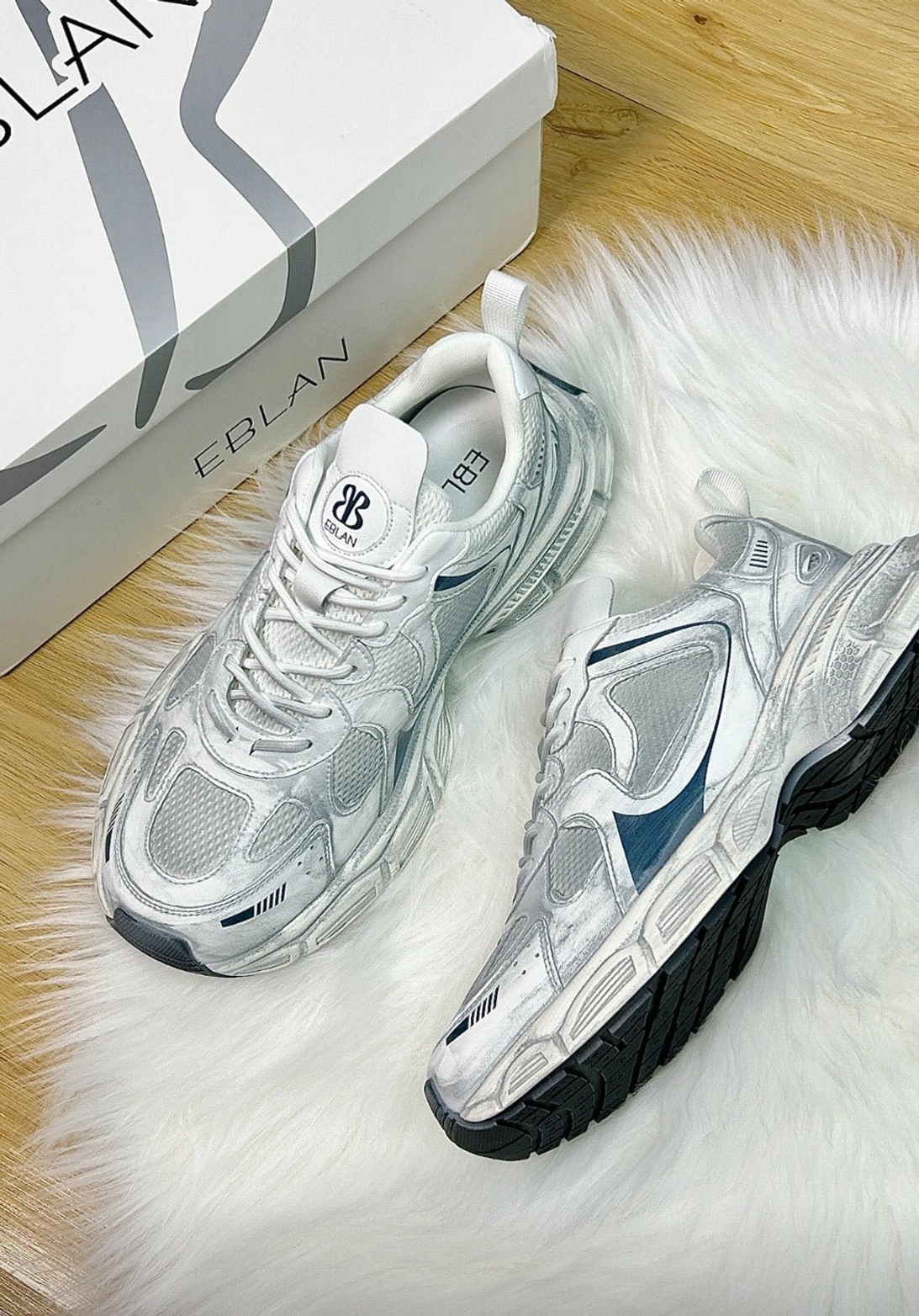 Layered metallic runner sneakers with mesh inserts, synthetic overlays, padded tongue, and chunky dad sneaker shape