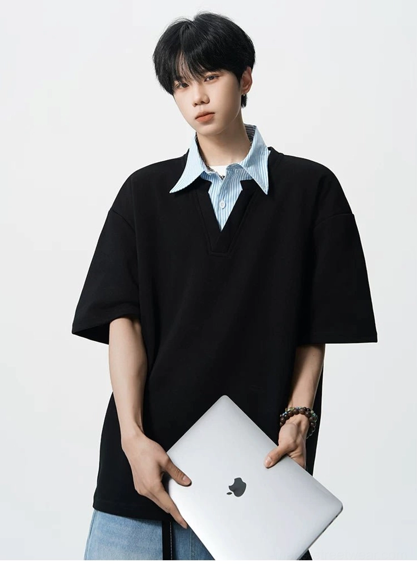 Black oversized layered polo shirt for men with striped collar insert and loose Seoul fashion silhouette
