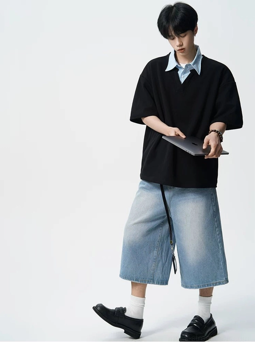 Three quarter view of black fake two-piece oversized polo tee for men with striped collar and relaxed fit