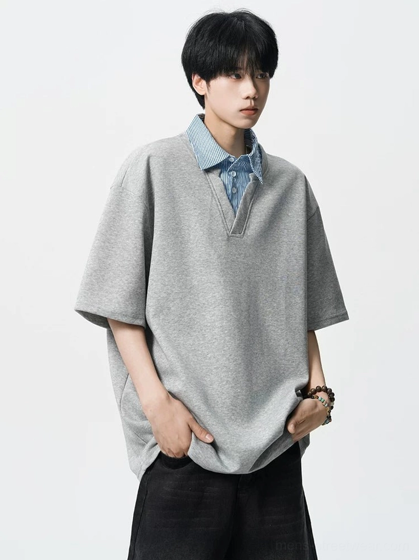 Gray fake two-piece oversized polo tee for men featuring a blue and white striped shirt collar insert