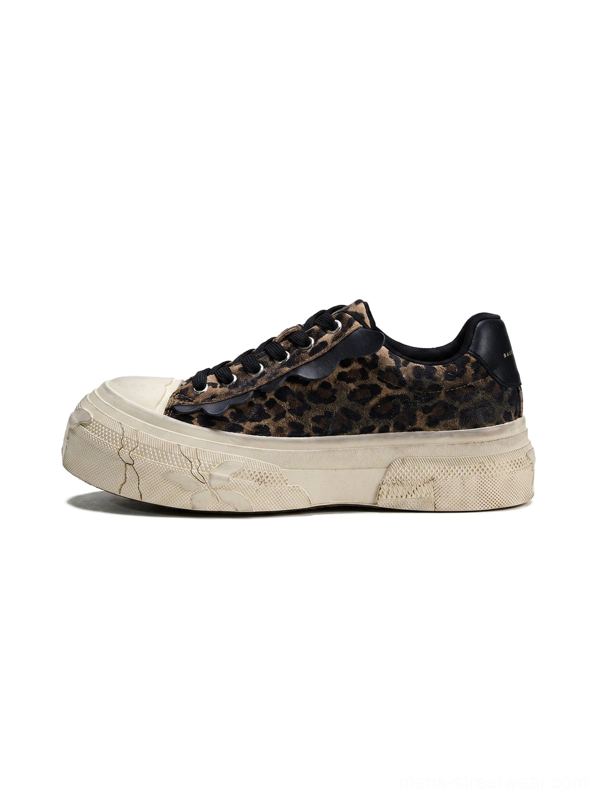 Side profile of leopard distressed platform canvas sneakers with thick weathered off-white platform sole black laces and black heel tab