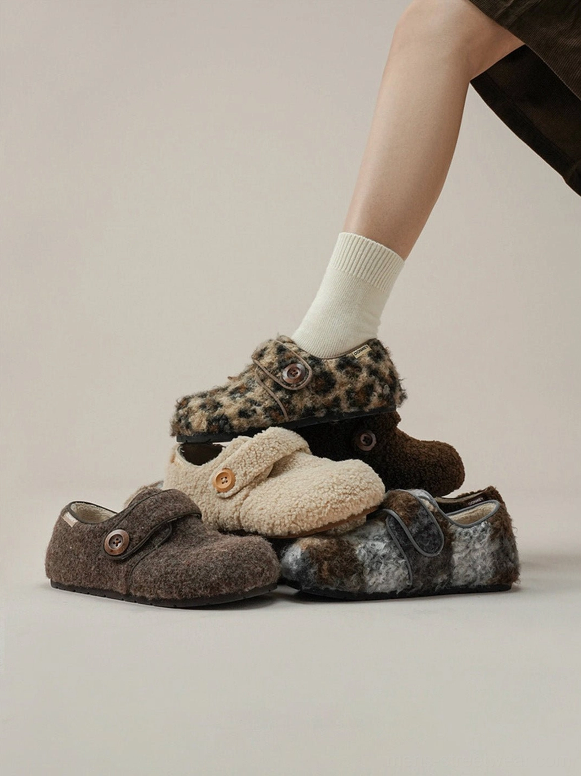 Leopard faux fur Velcro slip-on shoes worn in a cozy everyday streetwear lifestyle setting