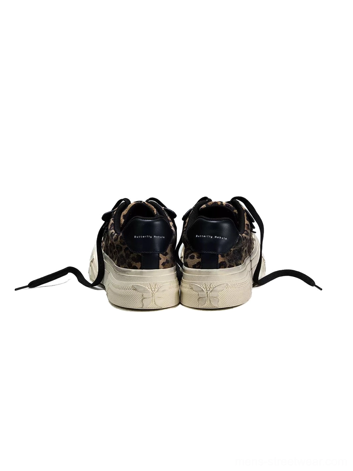 Rear view of paired leopard platform canvas sneakers with black heel tabs embossed heel details and thick off-white soles