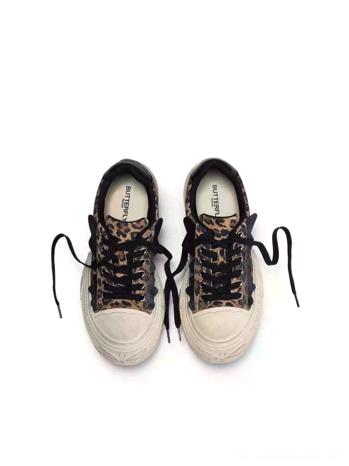 Top down flat lay of leopard print platform sneakers with black laces off-white rubber toe caps and branded insoles