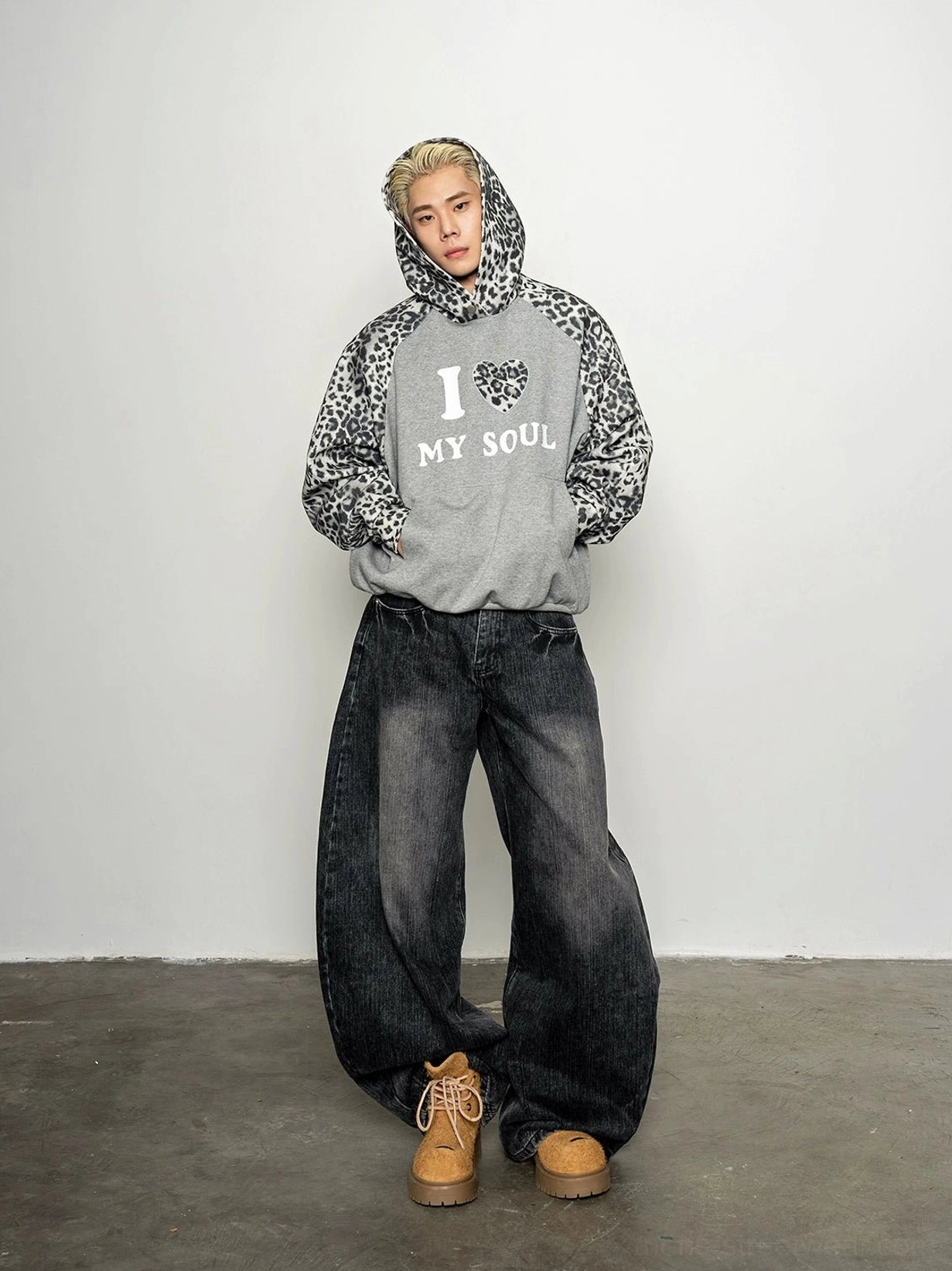 Oversized leopard print raglan hoodie with hood up and I Love My Soul graphic shown in a grey studio streetwear outfit