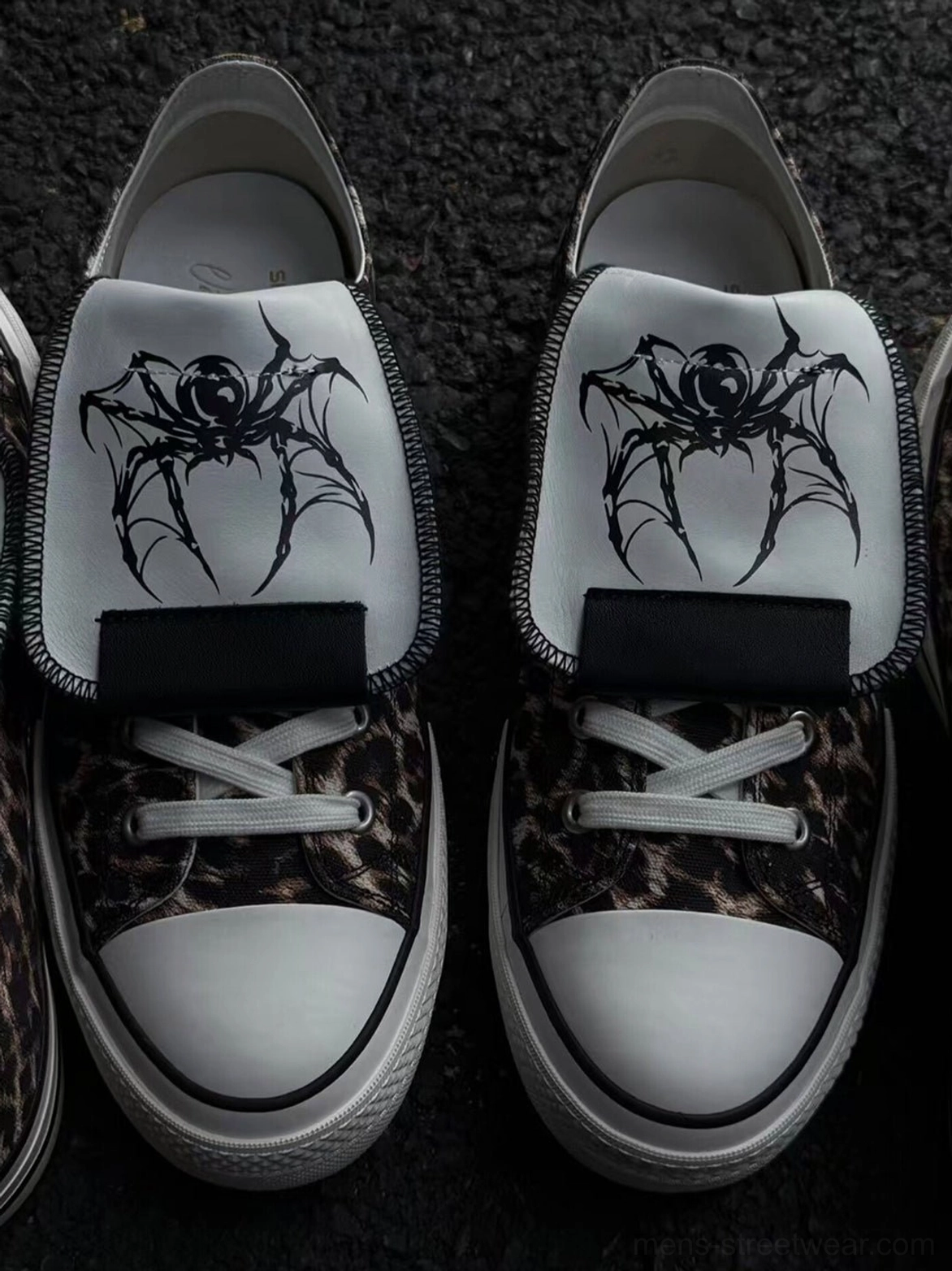 Leopard spider-tongue canvas sneakers in a detailed product view, highlighting the animal print upper, embroidered tongue, laces, and rubber sole
