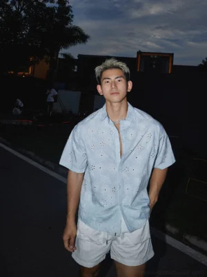 Light blue floral eyelet short sleeve shirt worn with white shorts in a relaxed Korean streetwear outfit