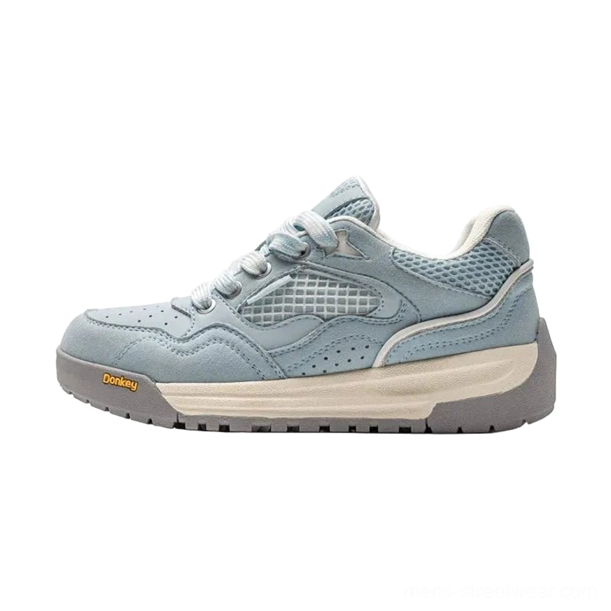 Light blue and gray retro runner sneakers with suede mesh upper thick platform rubber sole and casual streetwear design