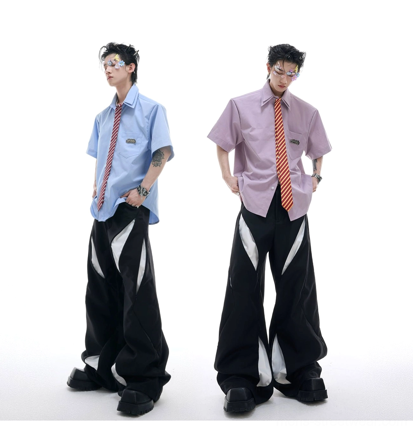 Two male models wearing light blue and light purple short sleeve shirt and tie sets with wide leg pants