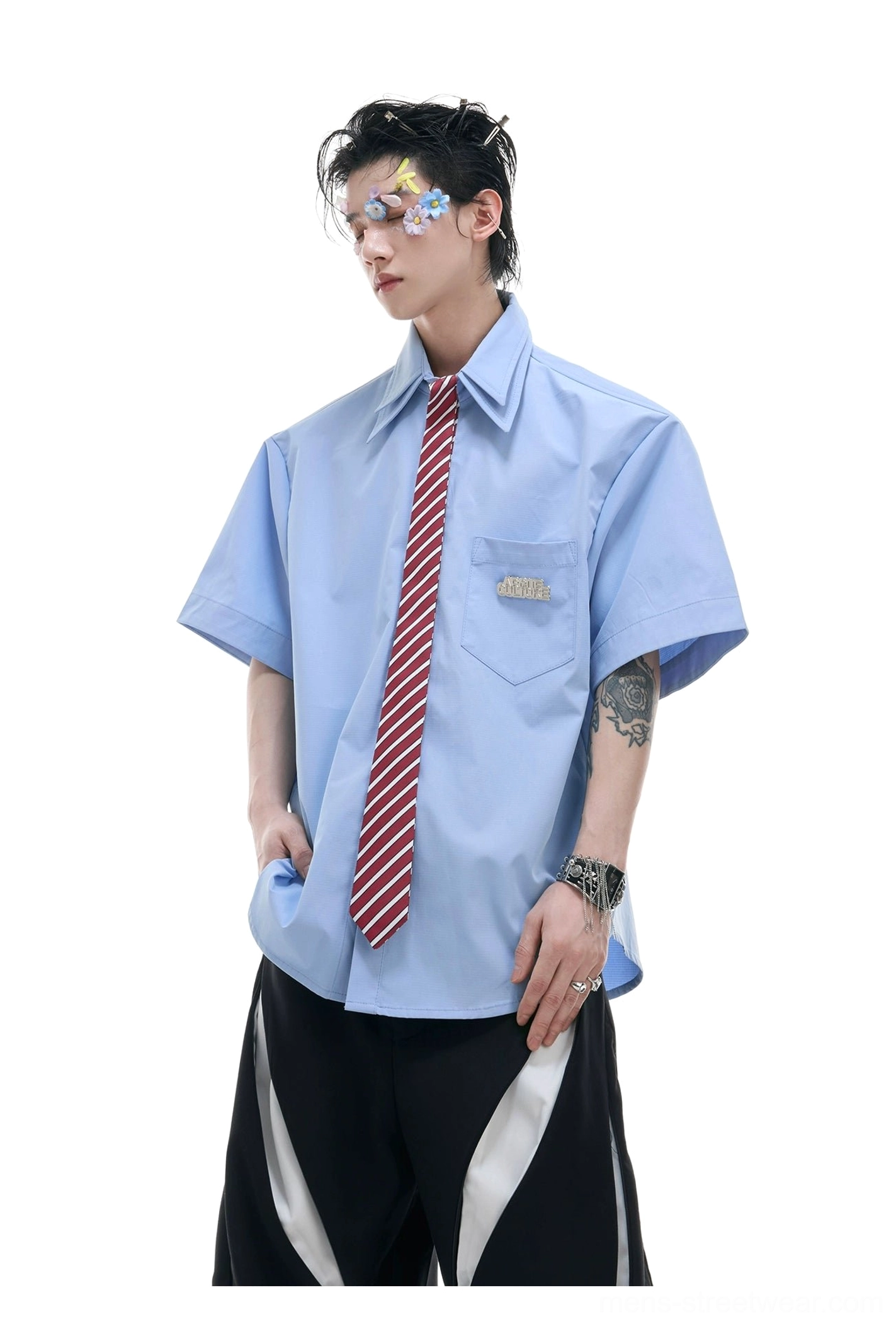 Light blue loose fit short sleeve shirt with orange red striped necktie and silver wristwatch