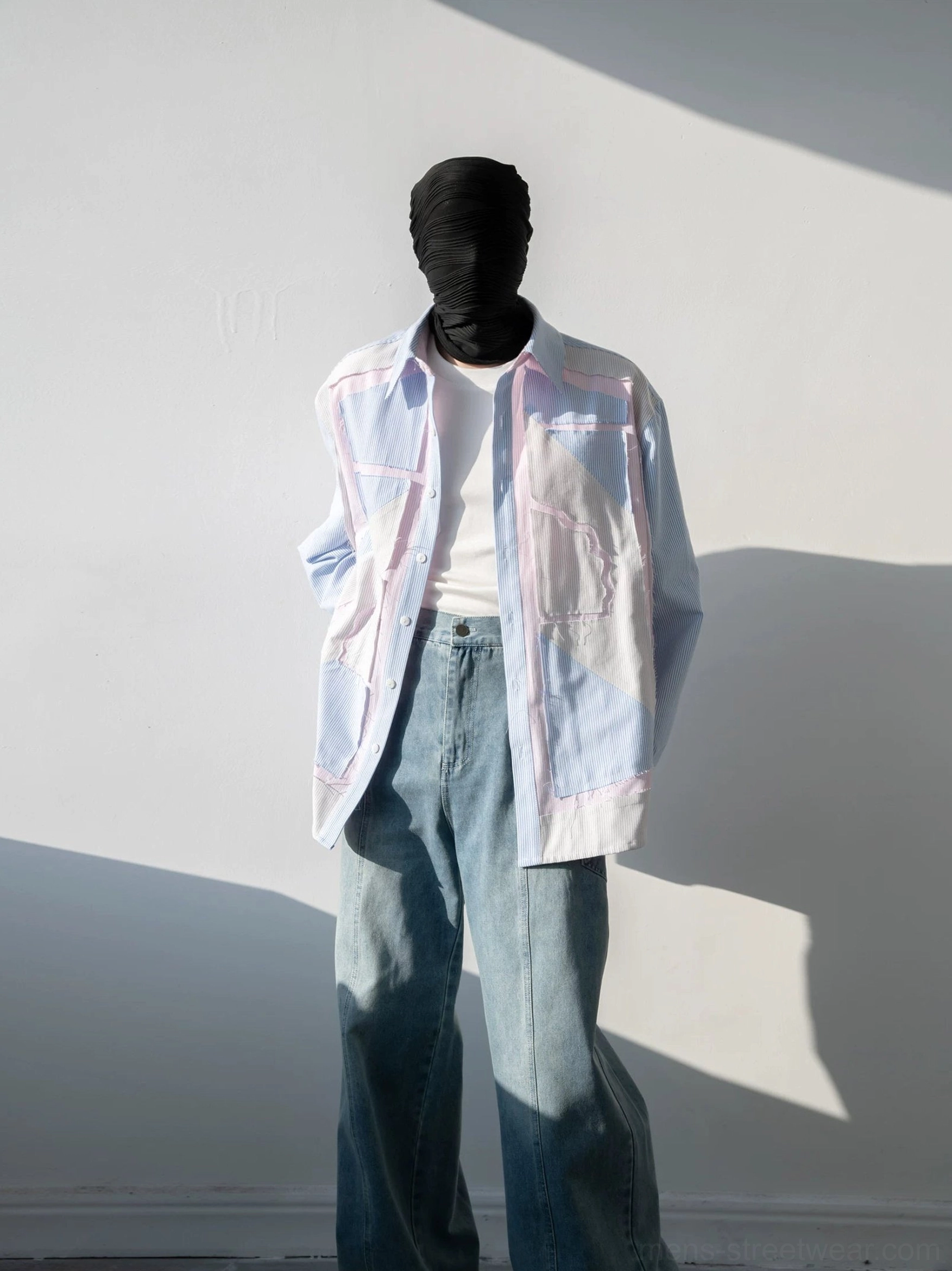 Light blue oversized pinstripe patchwork shirt with pink piping and geometric chest panels front outfit view