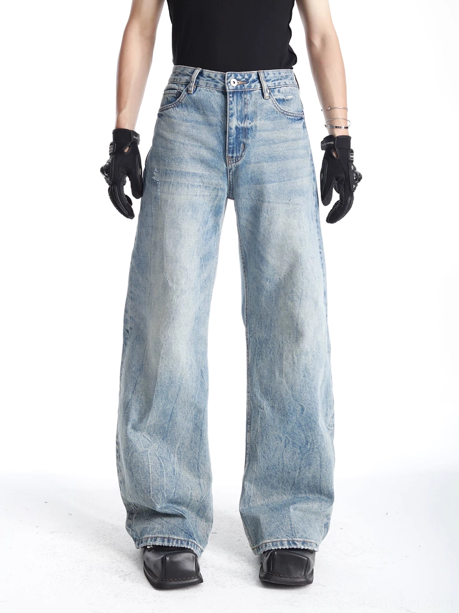 Men's light blue vintage wash barrel-leg jeans front full-body view with relaxed wide-leg streetwear silhouette
