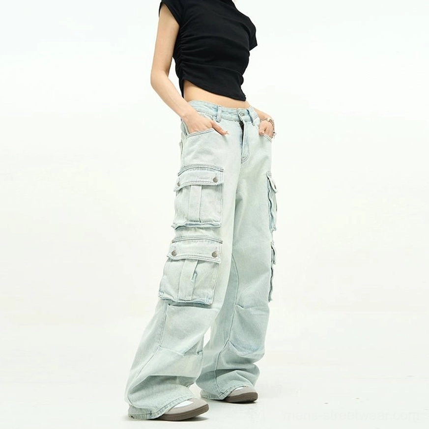Light blue wide-leg cargo jeans product detail with relaxed baggy fit, multiple flap pockets, high-rise waist, and contemporary Asian streetwear styling