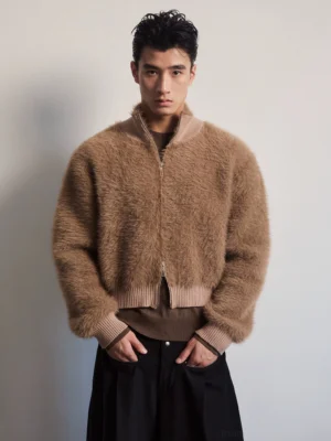 Front view of a light brown fuzzy zip-up bomber jacket with ribbed stand collar and cropped relaxed fit