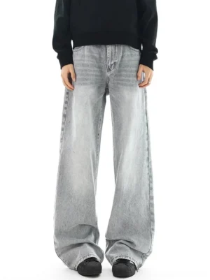 Front view of light gray acid-washed wide-leg jeans with relaxed fit, high-rise construction, and minimalist East Asian streetwear styling