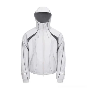 Light gray contrast-panel hooded shell jacket front view with dark gray curved panels, zip closure, side pockets, and adjustable cuffs